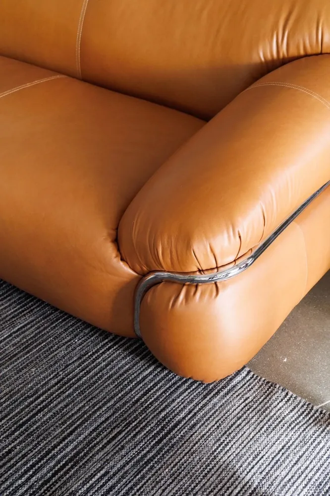 Camel leather sofa arm after scuff repair and conditioning
